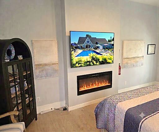 Electric fireplace and Smart TV in Queen Suite